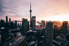 an aerial view of the toronto skyline at sunset