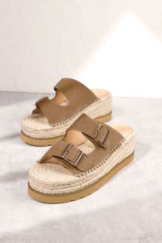 Women's Woven Platform Two Strap Slip-On Sandals Hazel Slide-On Sandals Slip on these Hazel Slide-On Sandals for effortless style and comfort. The open toe and back, adjustable straps with buckle details, and woven platform embody boho chic. Perfect for a trendy, playful summer look! Shop more of our Shoes, here! Details Available in sizes: 6-10 Available in colors: White and Taupe Slip-on design Open toe﻿ Open back Two straps Adjustable straps﻿ Buckle details Woven platform Summer Adjustable Platform Footbed Sandals, Summer Beige Platform Footbed Sandals, Summer Double Strap Platform Footbed Sandals, Beige Platform Footbed Sandals For Summer, Natural Color Closed Toe Sandals With Buckle Closure, Summer Vacation Toe Loop Footbed Sandals, Bohemian Sandals With Buckle Closure For Summer, Beige Bohemian Open Toe Wedge Sandals, Bohemian Beige Open Toe Wedge Sandals