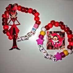 two bracelets with beads and magnets on them, one has an anime character