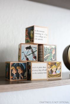 the wooden blocks are stacked on top of each other with disney's pictures in them