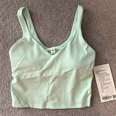 Nwt Lululemon Align Crop Tank Top A/B Light Support Mint Green Color Sz 4 Nulu Fabric Four-Way Stretch Sweat-Wicking Breathable Added Lycra Fibre For Stretch And Shape Retention Built-In Shelf Bra For Added Support Pockets For Optional, Removable Cups Cropped Length Cut Above The Waist Intended For Low Impact Activities Casual Fitted Lululemon Sports Bra, Lululemon Casual Activewear With Built-in Bra, Lululemon Functional Summer Top, Functional Lululemon Tops For Summer, Lululemon Fitted Tops For Athletic Use, Fitted Lululemon Tops For Light Exercise, Lululemon Seamless Yoga Tops, Sporty Lululemon Tops For Pilates, Lululemon Compressive Yoga Top