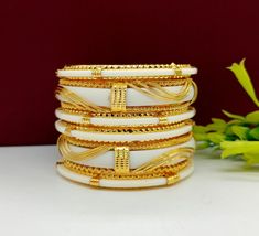 ❖ ❖ ❖ Features: ❖ An Indian styled Polki Bangles. ❖ Made from fine Quality Brass with Gold Platting. ❖ Ready to be given as a gift. ❖ Easy and Convenient way to Wear. ❖ It looks prettier than the images. Direct Images on hand is also attached. Size of Bangle & Other Details: ❖ Size:- Choose Your Size ❖ Quantity:- 6 pieces 1 bangle set ❖ Material:- Fine Quality Brass with Gold Platting This gold plated unique bangles are glamorously impressive, yet subtle, the design is clean and extremely ac Yellow Bangles Set, Indian Wedding Bangles, Festive Heavy Gold-plated Bangle, Festive 22k Gold Hand-set Bangle, Festival 22k Gold Hand-set Bangle, Heavy Gold Bollywood Bangle, Polki Bangles, Pearl Cluster Ring, Designer Bangles