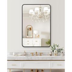 a bathroom vanity with a large mirror above it