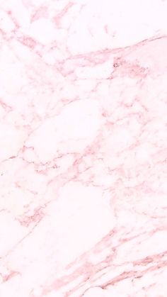 a pink marble textured surface that looks like it could be used as a background