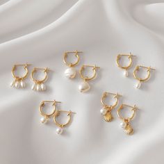 Sweet and dainty, these gold huggie earrings feature a dangling pearl charm of your choice. These are all made of 14K gold filled materials and are tarnish-resistant, water-resistant, and hypoallergenic. Hoop measures 9, 12, or 15mm in diameter, depending on your choice. Pearls are all genuine freshwater pearls. Gift box included with purchase. --------------------♥ PROMOS ♥-------------------- Want 10% off? Join the mailing list by visiting http://bit.ly/vedern . Just leave me a note at checkou Charm Earrings Hoop, Hoop Earrings Pearl, Gold Hoop Pearl Earrings, Gold Huggie Pearl Earrings, Gold Dangle Earrings, Fantasy Earrings, Vintage Jewelry Necklace, Freshwater Pearl Jewelry, Snake Earrings