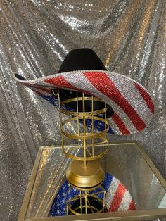 The “America” hat is perfect for your summer on the lake, BBQs, Labor day weekend, rodeos, and any events you may be attending! This hat will feature the American Flag print on the bottom. Choose whether you want crystal rhinestones on the top brim as well, or leave it plain with the crystal hat band that comes with it! **Please note - due to the bright colors on the American flag hat, they can fade over time, especially if they are exposed to rain or water** This hat features: Black straw hat U Crystal Hat, America Hat, Black Straw Hat, American Flag Hat, Flag Hat, The American Flag, Labour Day Weekend, American Flag Print, Labor Day Weekend