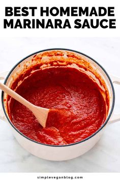 the best homemade marinara sauce in a white pot with a wooden spoon and text overlay