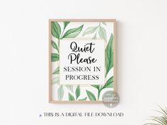 a green leafy print with the words quiet please session in progress, on a white wall