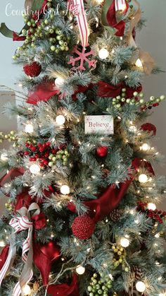 a christmas tree decorated with red, white and green ornaments