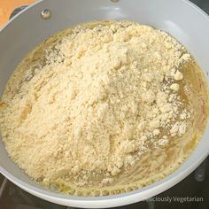 a white bowl filled with food on top of a stove