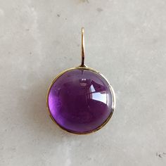 This stunning pendant is set in 14k Solid Yellow Gold with Natural Purple Amethyst with utmost precision. It is an unique gemstone pendant for nearly every occasion and is completely hassle-free jewelry. ITEM DETAILS Gem : Purple Amethyst  Gem Size : 12x12mm Gem Shape : Round cab Gem Weight : 8.50carats Gold Weight : 0.28 gram Gold Purity : 14k (58.66 % )  Gross Weight : 1.98 gram The Gold purity is guaranteed and it comes with an authentic 14KT gold hallmark. Since my items are handmade, they a Purple Gemstone Round Pendant Necklace, Formal Amethyst Pendant Gemstone, Elegant Purple Pendant Gemstones, Purple Pendant Jewelry With Large Stone, Amethyst Pendant With Large Stone, Handmade Jewelry Box, Amethyst Gem, Amethyst Pendant, Unique Gemstones