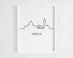 a black and white photo with the word venezia in it's center