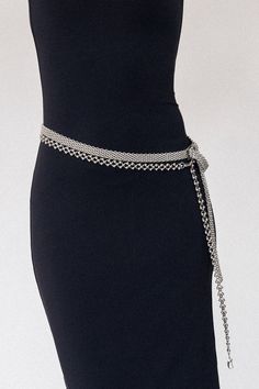 Inspired by celestial beauty, the Nova Silver Chain Belt features interconnected circular links adorned with metallic spheres that evoke the graceful rotation of planets and stars. Crafted from high-quality stainless steel, this stunning belt offers a sleek, polished finish that shines with cosmic allure. Designed for versatility, the Nova can be worn around the waist for a bold, modern statement or styled as a necklace to elevate any look. Whether you're dressing for a special occasion or addin Luxury Chain Link Belt For Party, Luxury Metal Chain Belt For Party, Luxury Metal Chain Belt For Formal Occasions, Elegant Silver Chain Belt For Evening, Silver Metal Waist Chain With Chain Strap, Elegant Silver Metal Chain Belt, Luxury Silver Chain Belt For Formal Wear, Luxury Silver Chain Belt For Formal Occasions, Silver Chain Belt For Party