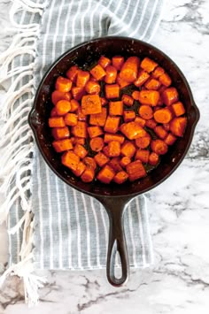 cooked sweet potatoes in a cast iron skillet