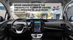 the interior of a car with an ad on it's display screen that says never underestimite the the therapeuti power of driving and listening to loud music