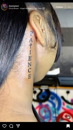 the back of a woman's head with an ear tattoo that reads, patient