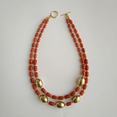 < Orange coral necklace with brass beads > The product is made according to the model of authentic Ukrainian jewelry. The coral is natural, from the bottom of the Pacific Ocean. > Necklace length - 36 cm (14.1 in) > Necklace weight - 40 gm Elegant Heart Beads For Jewelry Making, Double Strand Polished Bead Necklaces, Double Strand Polished Beads Necklace, Elegant Double Strand Spacer Beads, Elegant Heart Beads For Gifts, Double Strand Gold Beads Jewelry, Elegant Double Strand Beaded Necklace With Large Beads, Gold Beaded Necklace With Oval Gemstone Beads, Gold Beaded Necklace With Heart And Round Beads