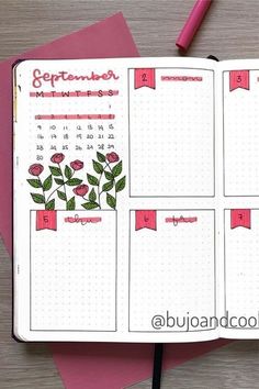 an open planner with flowers on it