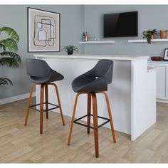 two stools in front of a bar with a tv on the wall behind it