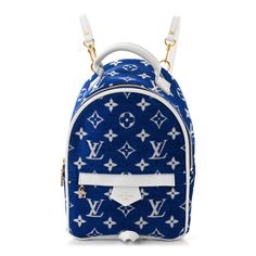 This is an authentic LOUIS VUITTON Jacquard Velvet Monogram Palm Springs Backpack Mini in Blue. This backpack features white Louis Vuitton monogram on jacquard velvet in blue. The bag features a white leather top handle, white leather trim, and adjustable straps with polished gold hardware. The zipper opens to a blue fabric interior with a pocket. White Louis Vuitton, Louis Vuitton Backpack, Mini Blue, Lv Bag, Palm Springs, Blue Fabric, Leather Top, Authentic Louis Vuitton, Leather Trim