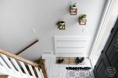 an overhead view of shoes and plants on the stairs