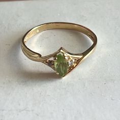 Vintage 14k Marquise Peridot Ring Gold Amazing Rare Marquise Simple Green Peridot With Two Diamonds In A Simple Yellow Gold Ring, Marked 14k. How Wonderful! It’ll Make You Super Happy. Size 6, 1.7g Don’t Miss Out! Pet Smoke Free Shop Gold Peridot Engagement Ring, Peridot Vintage Ring, Unique Rings Gold, Peridot And Amethyst Ring, Indie Wedding Ring, Peridot And Diamond Rings, Vintage Dainty Engagement Rings, Natural Wedding Ring, Green Gem Engagement Ring