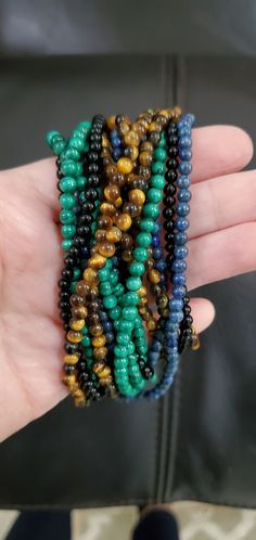 What a beautiful set of 4 beaded necklaces! It's 4 strands with removable gold clasp. They're 17 inches in length. They're versatile because they can be worn different ways; even one strand at a time. Cheap Multicolor Strand Jewelry, Affordable Vintage Multi-strand Beaded Necklaces, Black Lace Gloves, Semi Precious Necklace, Vintage Chain Necklace, Handmade Statement Necklace, Beaded Boho Necklace, Funky Necklace, Stylish Necklace