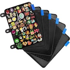 four black coasters with various cartoon stickers on the top one has blue handles