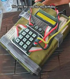 a cake that is made to look like a calculator with wires on it