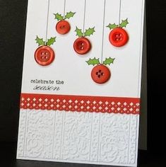 a card with buttons and holly on it