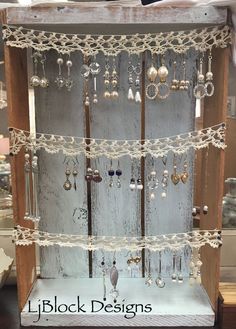 a display case filled with lots of earrings