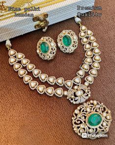 This stunning jewellery set is inspired by the renowned designer Sabyasachi. The set includes a beautiful necklace featuring an uncut polki kundan stone and a doublet stone. The necklace is made of brass and is perfect for women who love to accessorise with ethnic jewellery. The set is a great addition to any jewellery collection and is perfect for special occasions. The stone and brass material make this set a unique and durable piece. Get ready to turn heads with this exquisite jewellery set. Luxury Stone Work Jewelry Sets For Festive Occasion, Luxury Kundan Jewelry Sets With Intricate Design, Luxury Kundan Bridal Necklace With Stone Work, Luxury Kundan Jewelry Sets For Festive Occasions, Luxury Kundan Jewelry Sets For Reception, Diamond Kundan Necklace For Reception And Festivals, Designer Chandbali Bridal Necklace With Intricate Design, Heavy Bollywood Kundan Necklace With American Diamonds, Designer Bridal Chandbali Necklace With Intricate Design