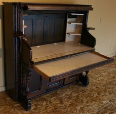 an old fashioned wooden desk with drawers