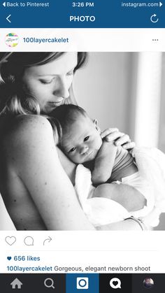 a woman holding a baby in her arms