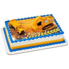 a birthday cake with a construction truck on it's side and blue trimmings