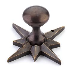 a metal object with four pointed stars on it