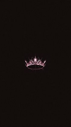 a crown is lit up in the dark