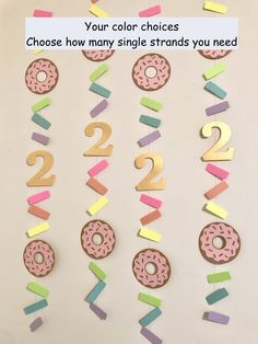 the numbers are made out of doughnuts and colored paper