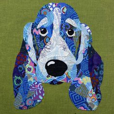 a dog made out of fabric on a green background