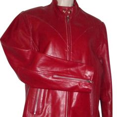 Fabulous, Nwot, Wilsons Leather, Size Small, Structured, True Red Leather, Short, Military Or Motorcycle Jacket With A Zip Front, Snap Closure At The Neck, Zippers At The Cuffs, Two Zip Close Pockets, A Tie Accent At The Bottom, Center In The Back, And A Snap Closure Bottom! Size: S; Bust: 40"; Sleeve Length: 18.5" At Inseam; Length: 13.5"; Bottom: 40"; Shoulders: 16". All Measurements Are Approximate. Red Fitted Leather Jacket For Formal Occasions, Formal Red Fitted Leather Jacket, Classic Red Fitted Leather Jacket, Classic Fitted Red Leather Jacket, Classic Red Fitted Biker Jacket, Classic Fitted Red Biker Jacket, Designer Fitted Red Leather Jacket, Designer Red Fitted Leather Jacket, Classic Red Leather Jacket For Work