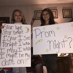 two women holding up signs that say prom night and starlight, which are written on them