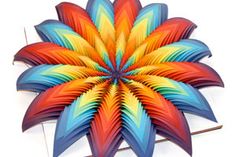 an image of a colorful flower made out of paper