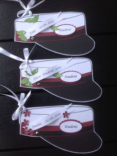 three tags with ribbons attached to them that say student and date on the back of each tag