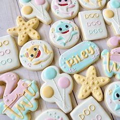 some decorated cookies are laying on a table