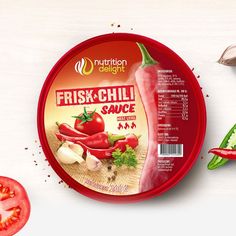 a package of fish and chilli sauce next to sliced tomatoes