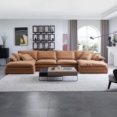 a living room filled with lots of furniture and decor on top of a white floor