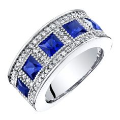 So much amazing artistry really makes this ring truly unique with its four princess-cut lab-created Blue Sapphire stones; free shipping from Peora Sapphire Birthstone Ring, Sapphire Anniversary Ring, Channel Ring, Sapphire Anniversary, Sapphire Birthstone, Sapphire Stones, Tiny Beads, Promise Rings For Her, Half Eternity Band