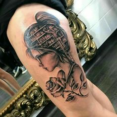 a woman's leg with a tattoo on it