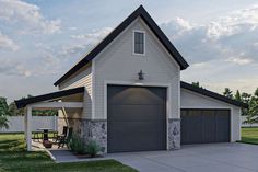 a garage with a picnic table in front of it next to a white fence and green grass