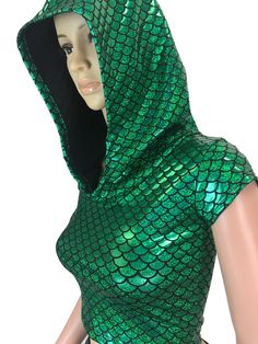 a mannequin wearing a green and black dress with a hoodie on it